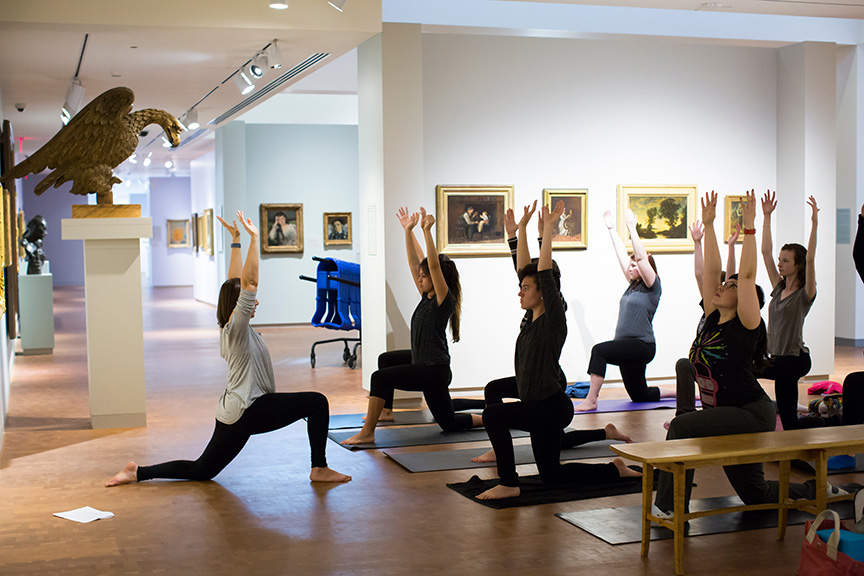 College students practicing yoga in the galleries