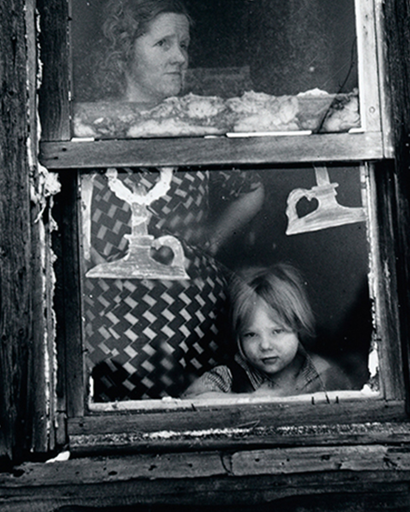 Arthur Rothstein, American,1915-1985, Wife and Child of Submarginal Farmer at Their Window  Decorated for Christmas 1937