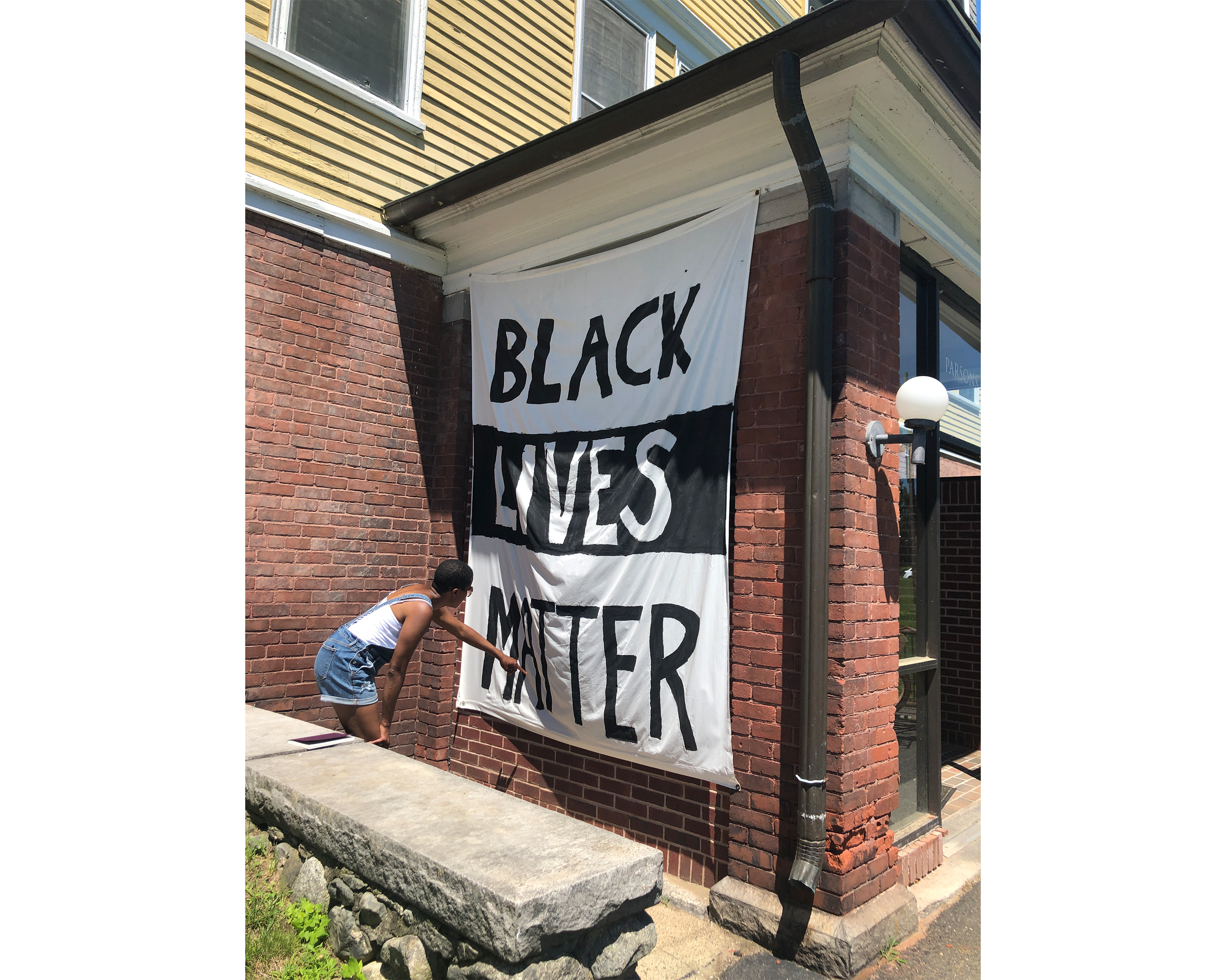 Amanda Williams next to a Black Lives Matter banner outside a Smith College house/dorm