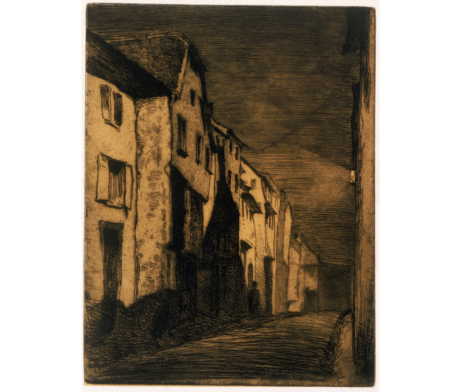 street with row of houses; dark sky