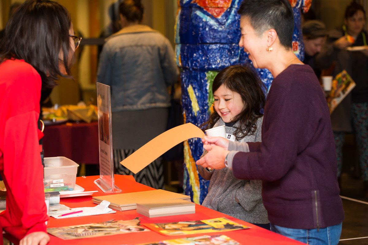 Visitors enjoying hands-on activities at Community Day