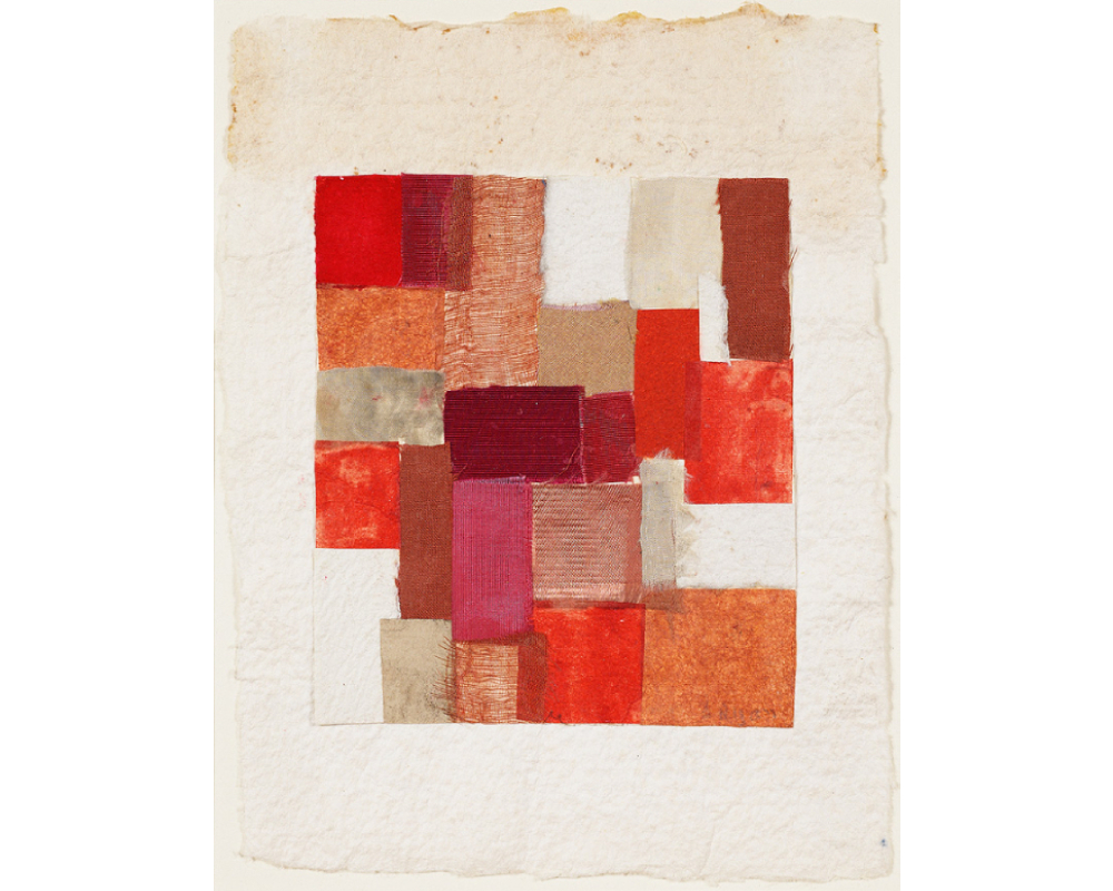 A rectangle of overlapping scraps of vibrant shades of red, pink, orange, salmon, white on a cream, textured piece of paper with organic edges.
