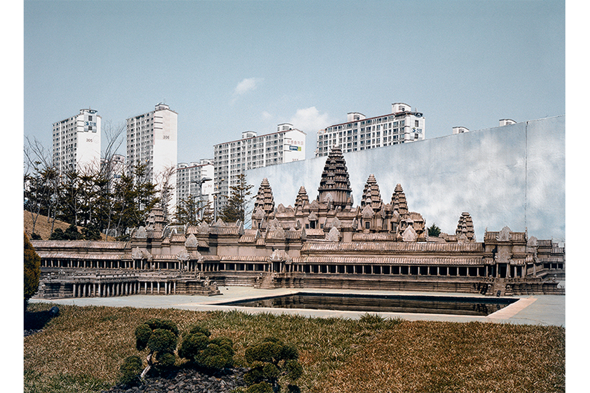 photographs of traditional Asian architecture against modern apartment buildings