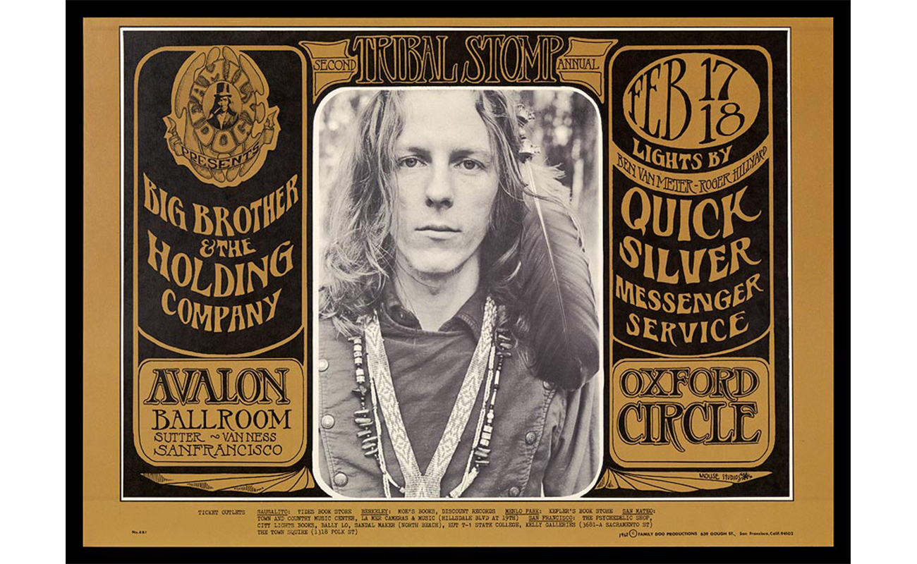 brown ground, black text around central photo of young man with long hair, feather in hair, wearing three bead necklaces