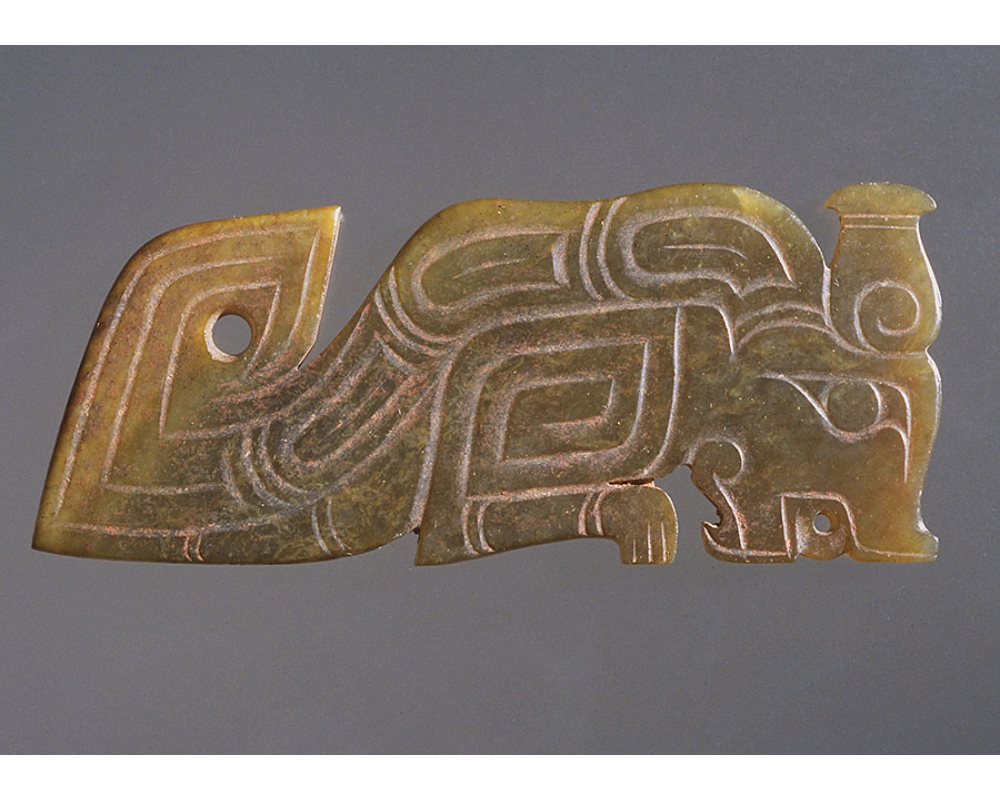 greenish translucent "Guei", bottle horns, deeply cut out detail motifs