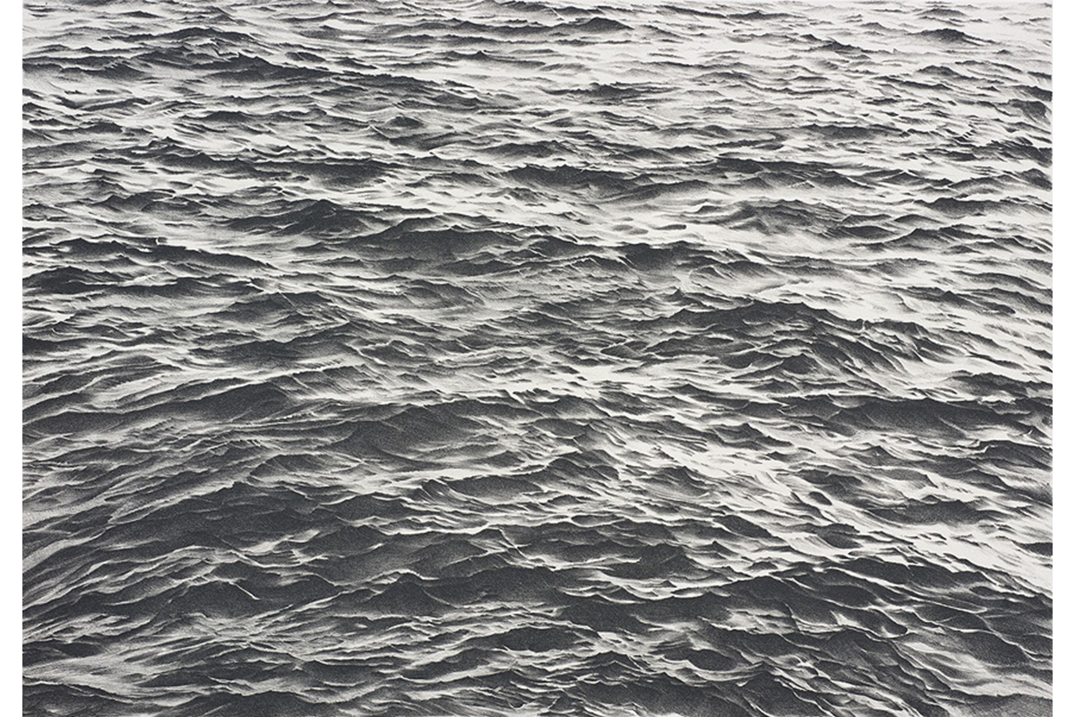 close up view of ocean waves in black and white