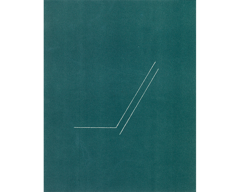 two thin, white diagonal lines in center of blue-green paper