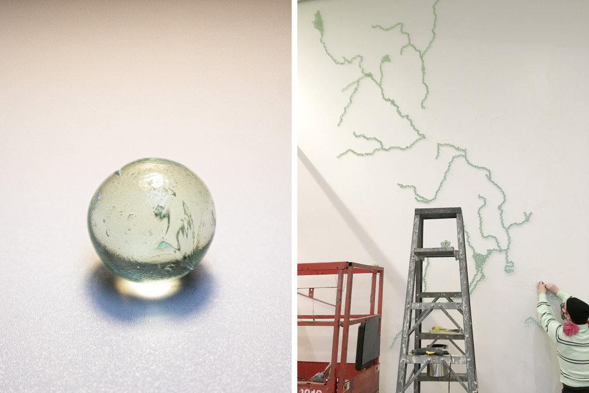 left: close up of translucent blue-green marble; right: next to a lift and a ladder, Felicia attaches marbles to the wall