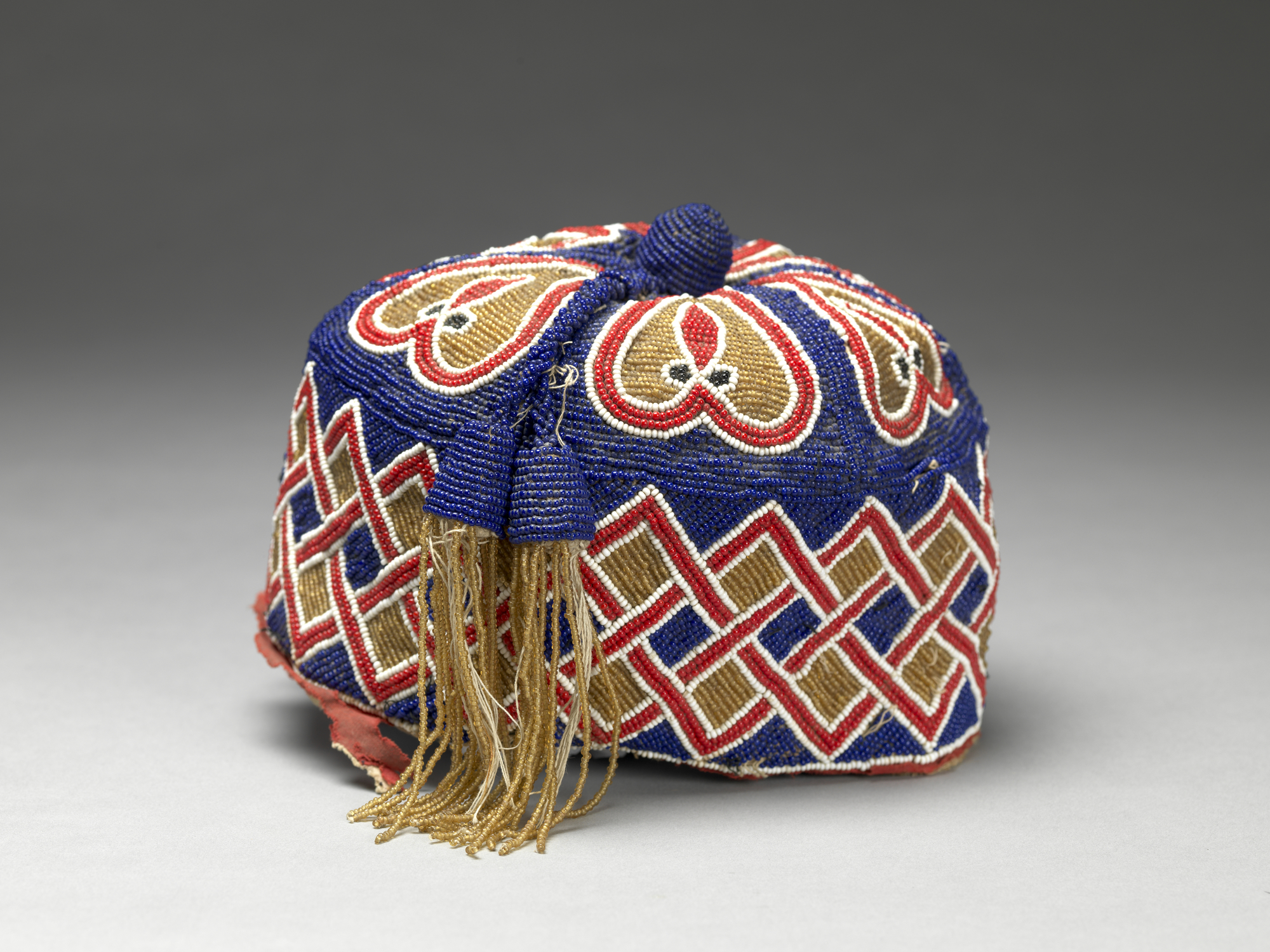 Brightly colored beaded head piece. 