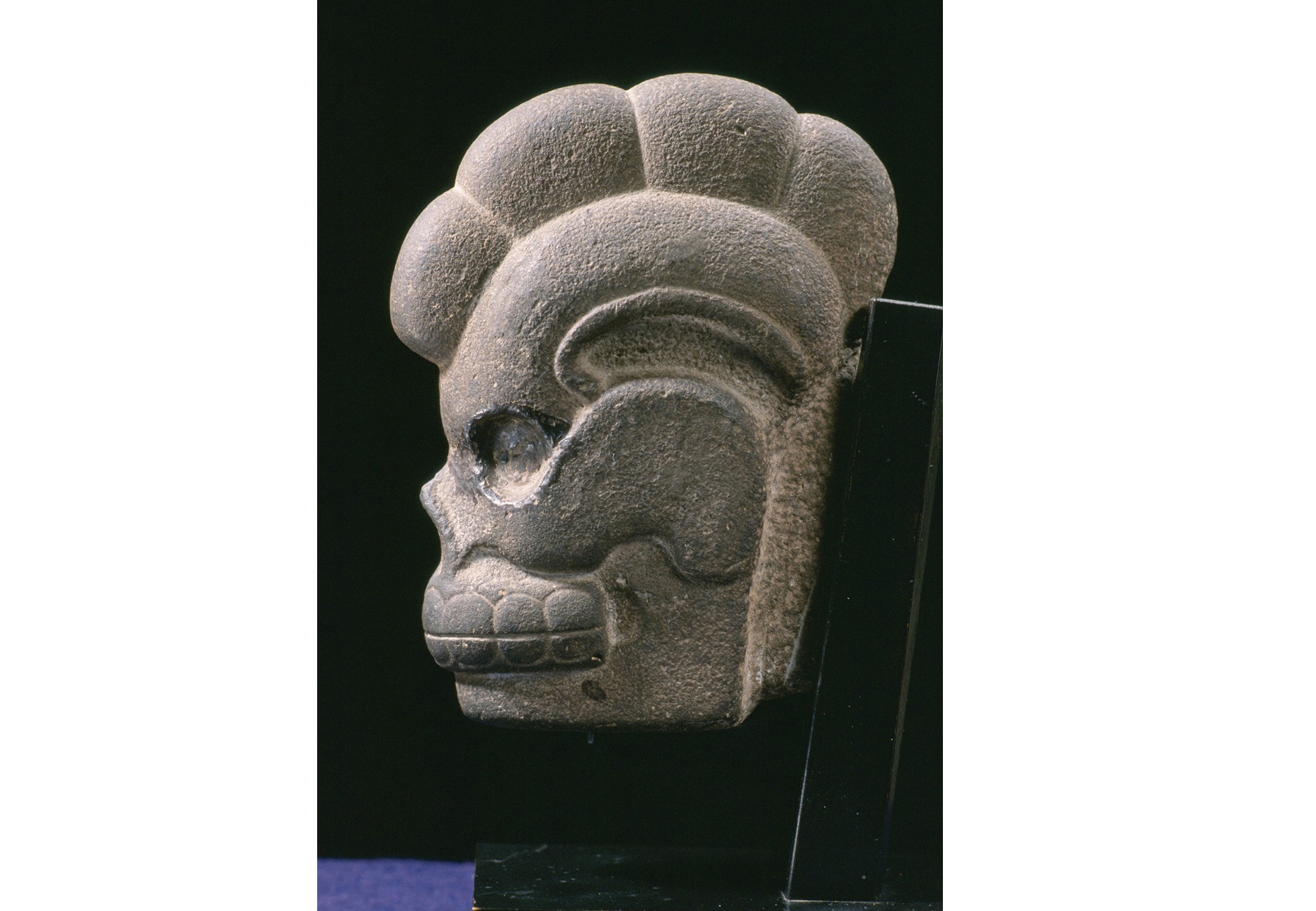 Stone head with helmut from Mexico
