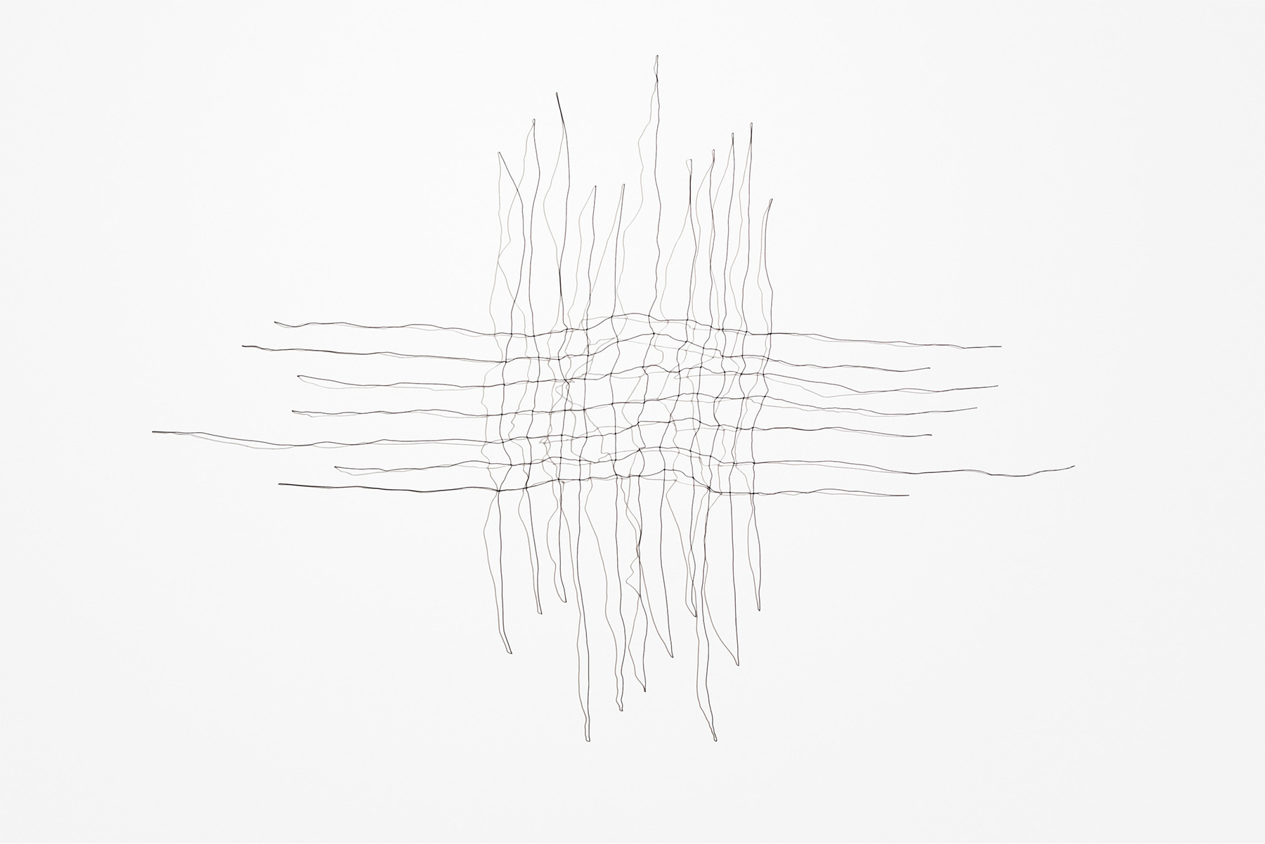 delicate wires running horizontally and vertically and overlapping to create a woven like image