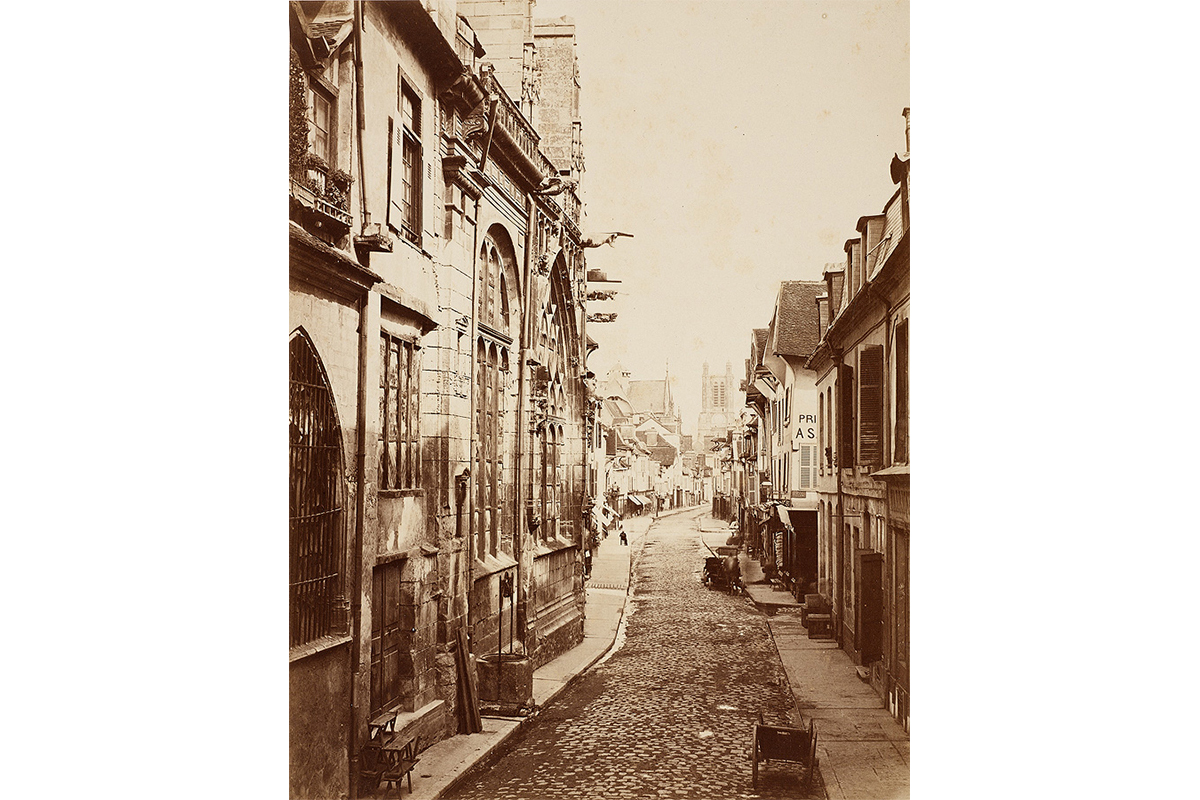 street with carts on the road and buildings on either side