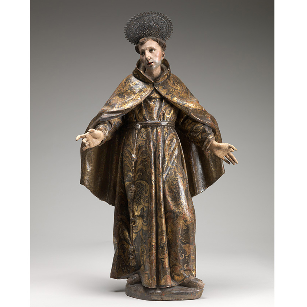 Wooden painted carved standing man with welcoming arms man in a robe