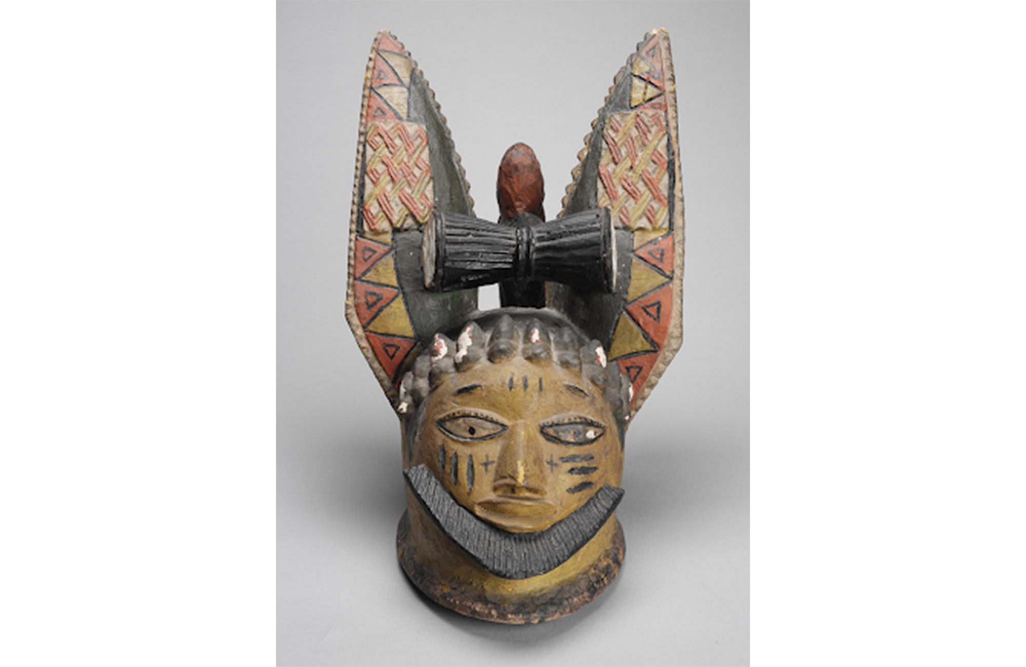 This exhibition explores a small part of a much longer and more widespread tradition of carved and painted wood. Objects from different time periods and cultures are highlighted on other floors of the museum.  The Egungun headdress is attributed to the Adugbologe atelier, a workshop that has produced Yoruba sculptures to serve the ritual needs of local patrons since the 19th century. In the early 20th century, the workshop expanded its market to create similar works for tourists and expatriates. This headdr