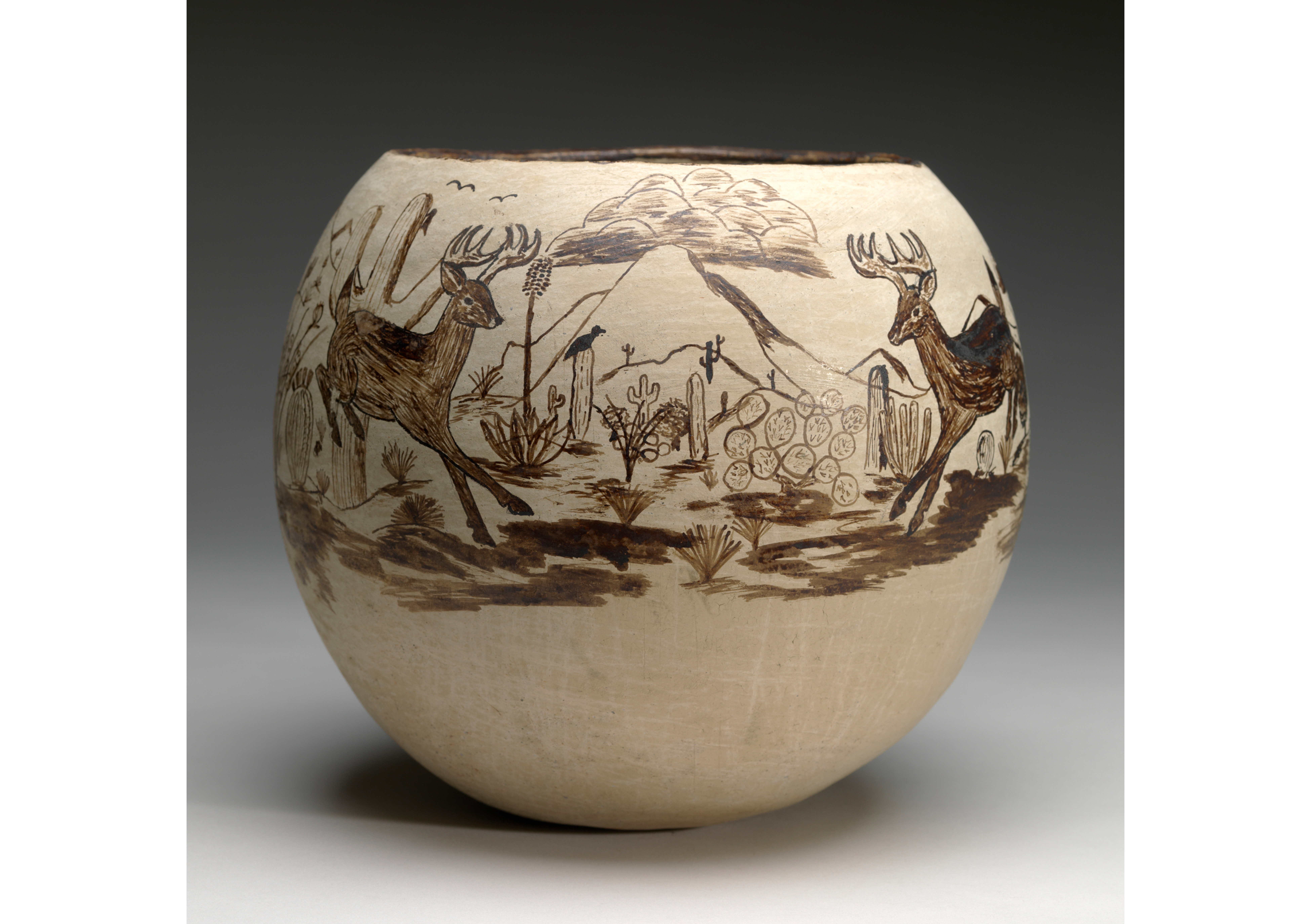 Large clay bowl with sepia drawings of animals and wilderness