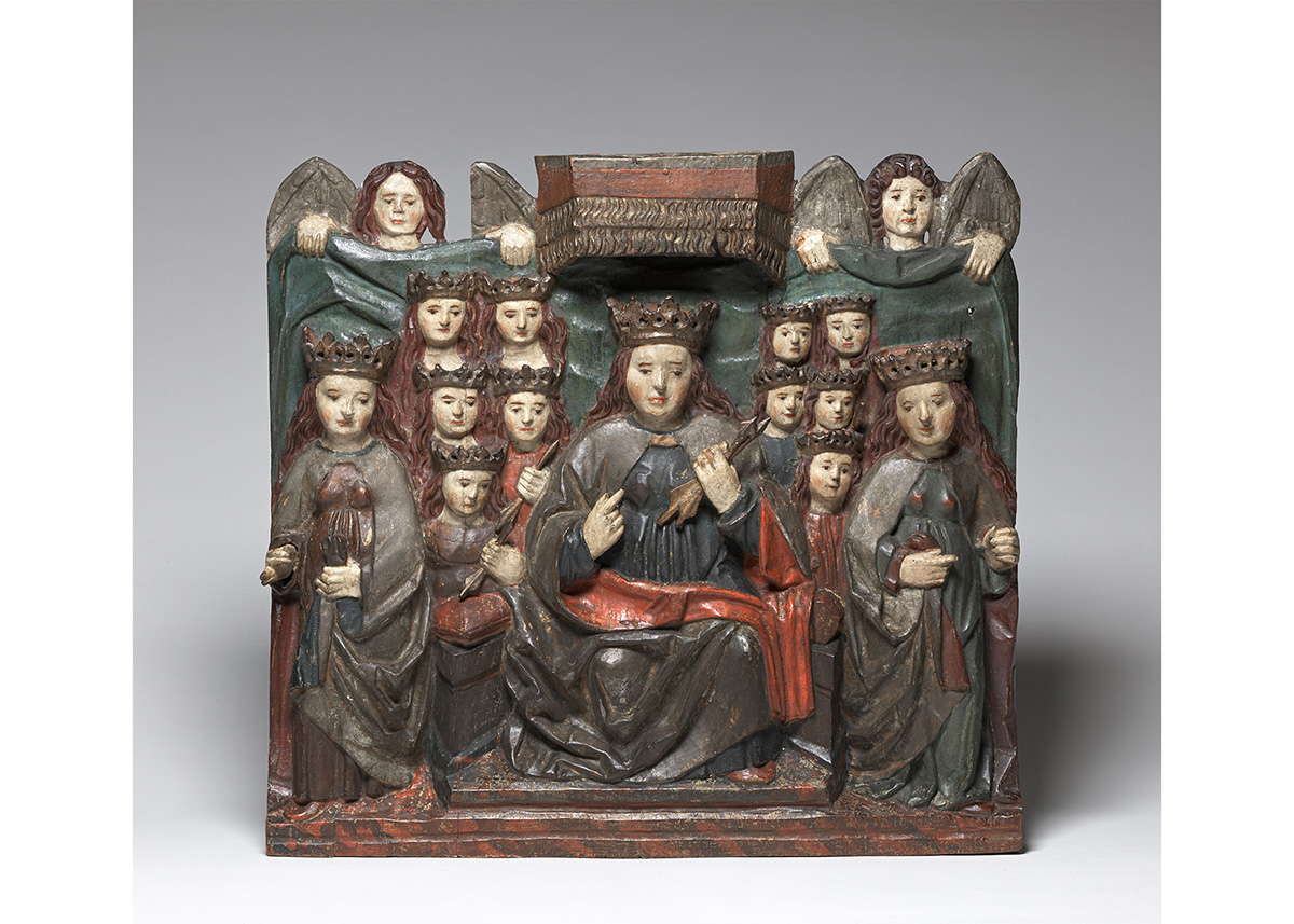 Painted wood carving of A saint (Saint Ursula) seated with angels surrounding her. Square altarpiece shape.