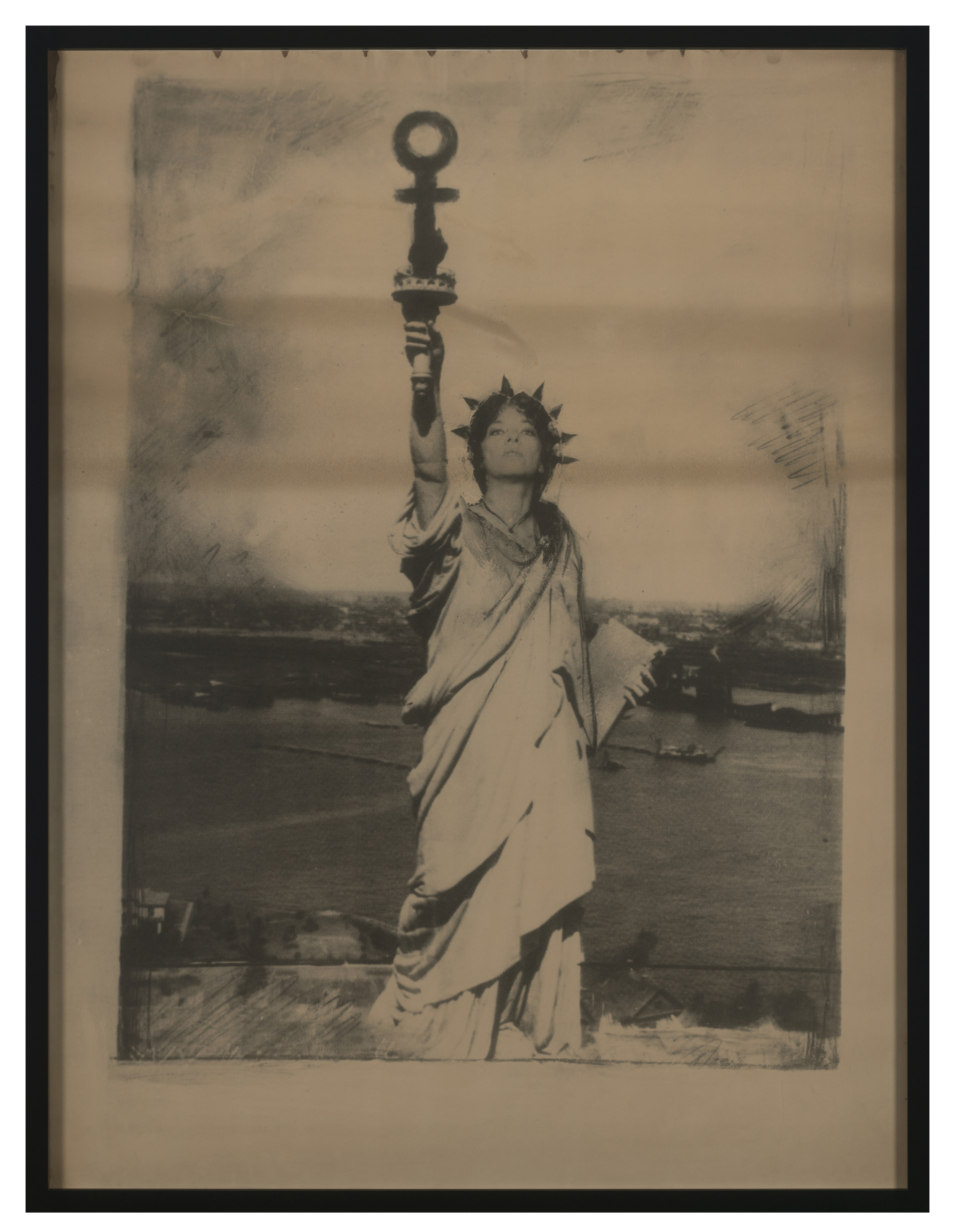 Photo monotype of the artists as the Stature of Liberty holding the symbol for a woman in place of a torch