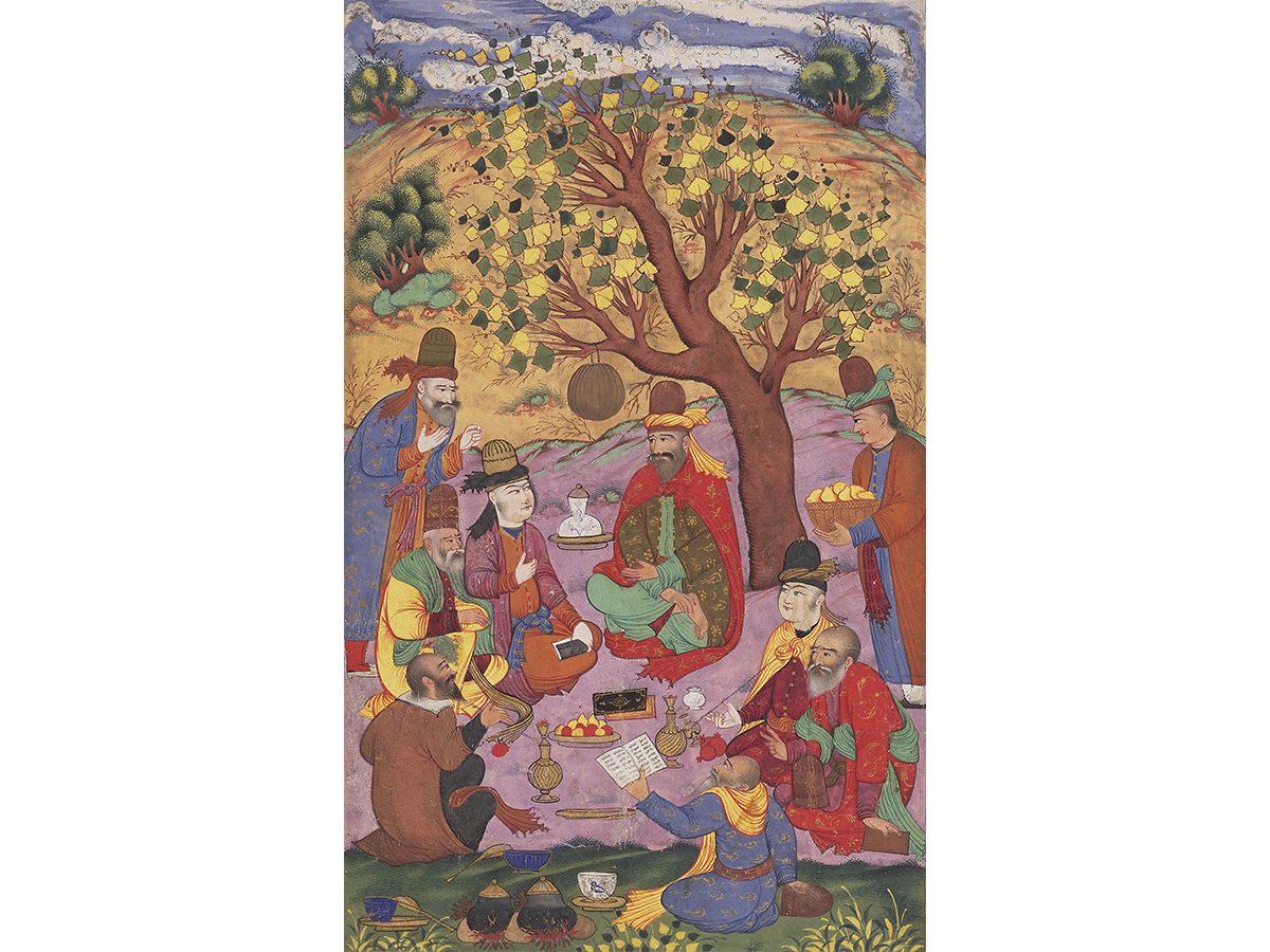 A colorful detailed painting of men dressed robes with hats sitting under a tree eating a meal together with one man reading