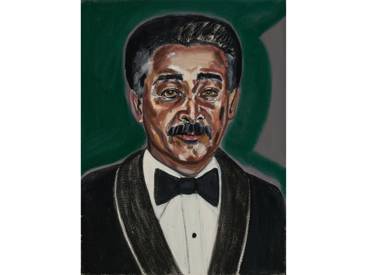 Man with short black hair with a moustache and in a tuxedo