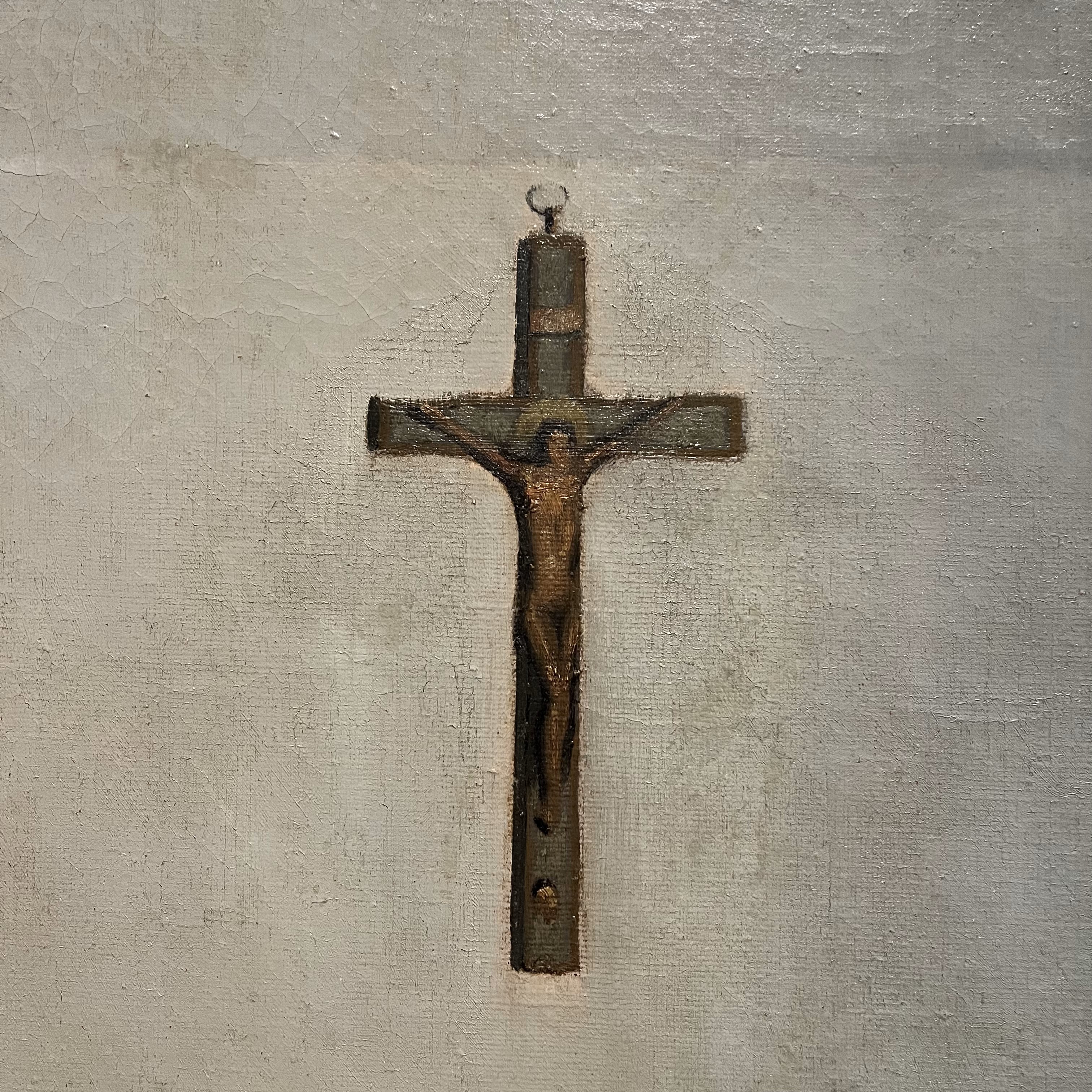 crucifix hanging on a white wall