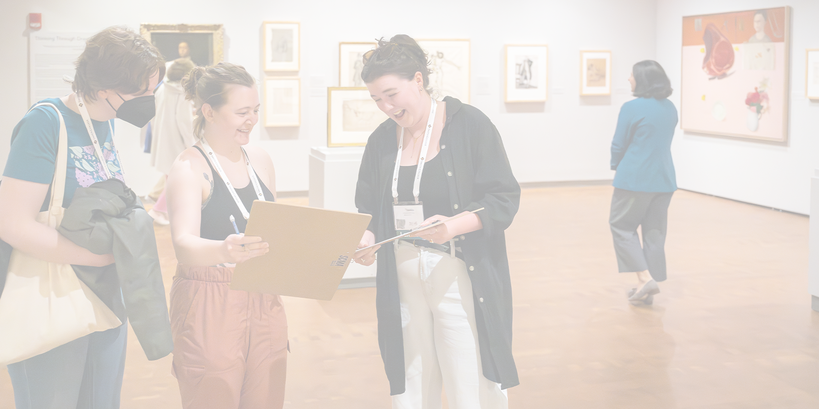 Five people engaging with artwork in gallery