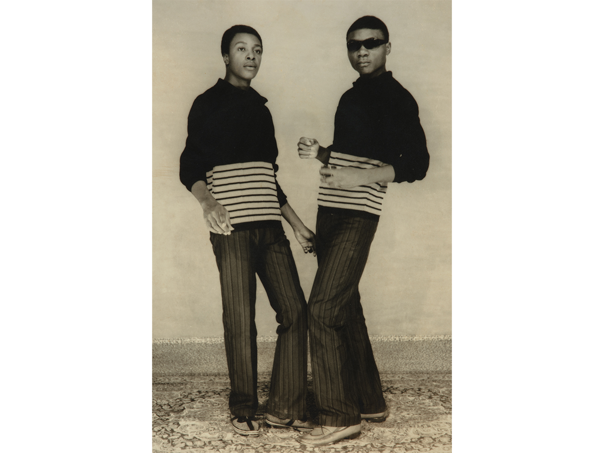 Two men dancing in matching outfits