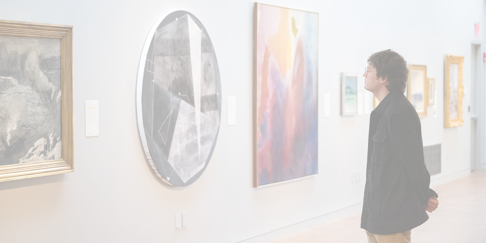 One person looking at a piece of art