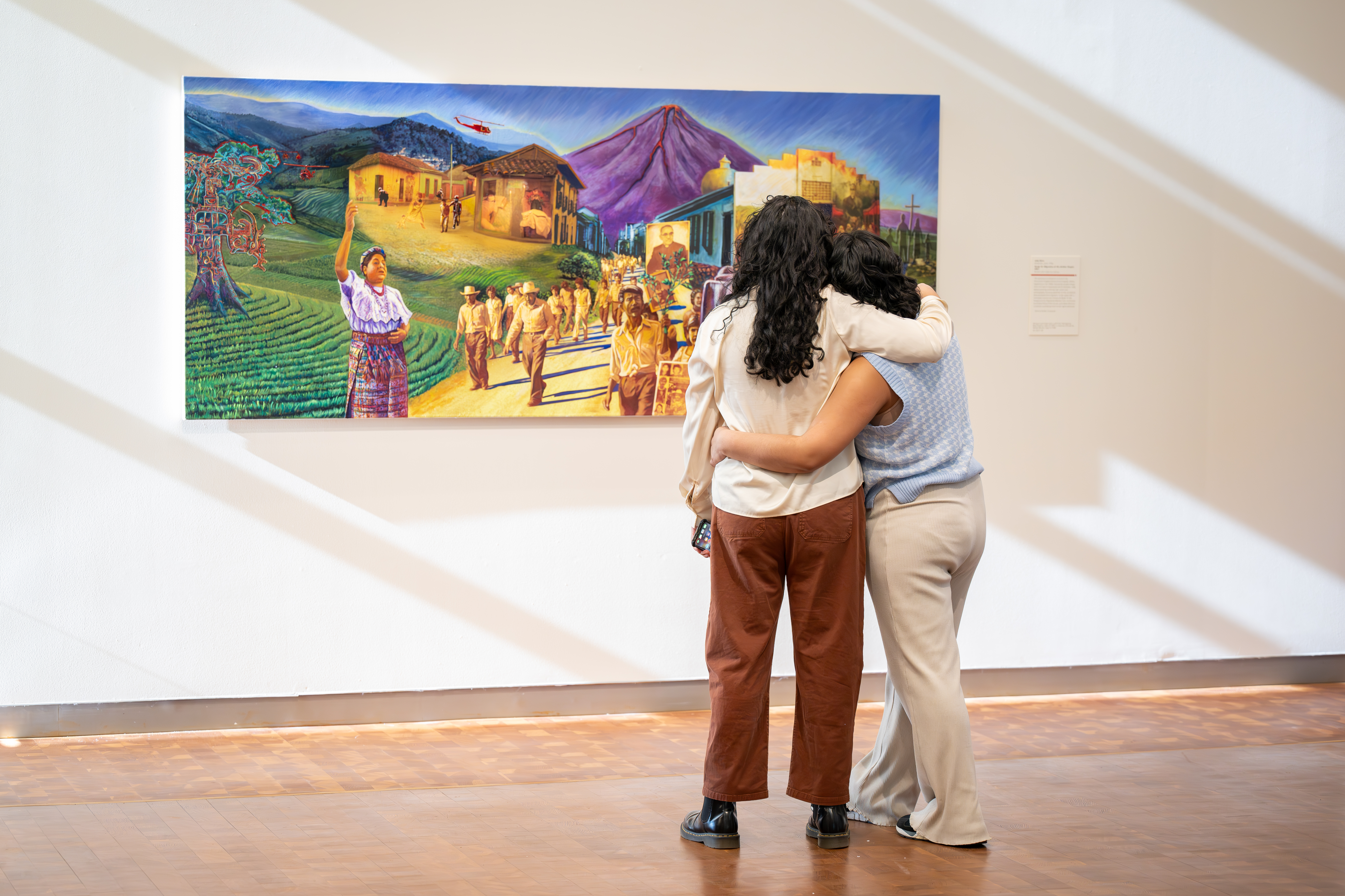 Two people Looking at a painting together