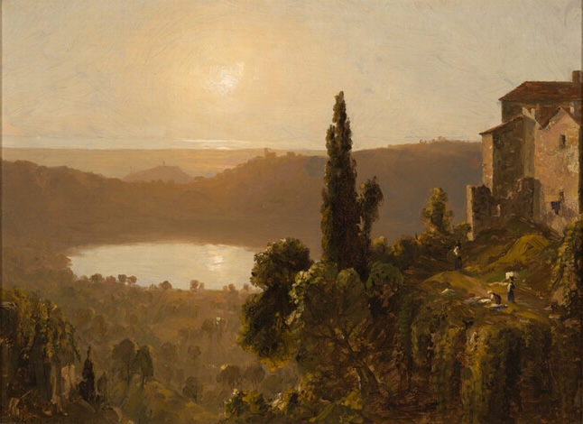 sunlit landscape looking in valley from up high at a lake 