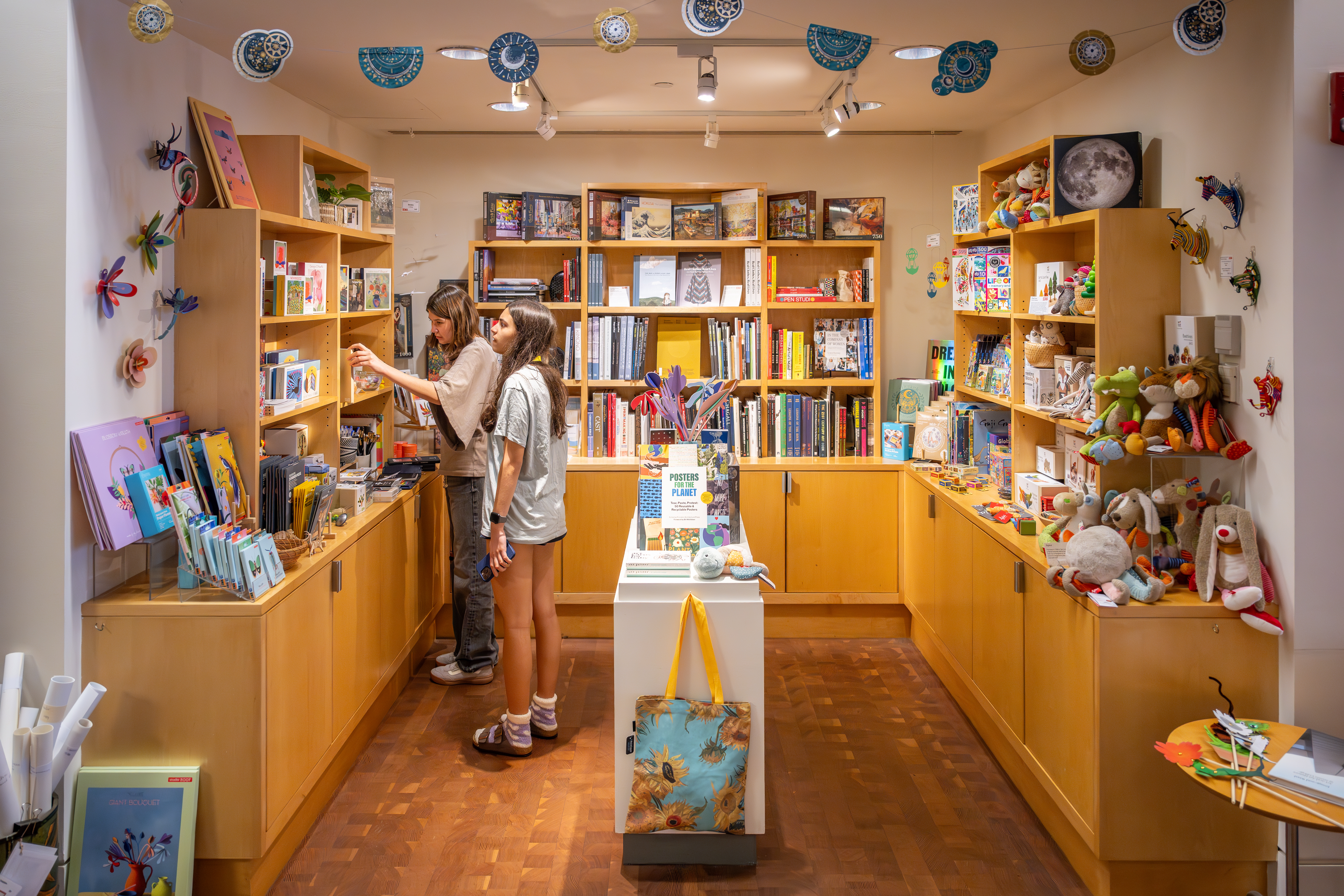 Two people browsing in the SCMA Shop