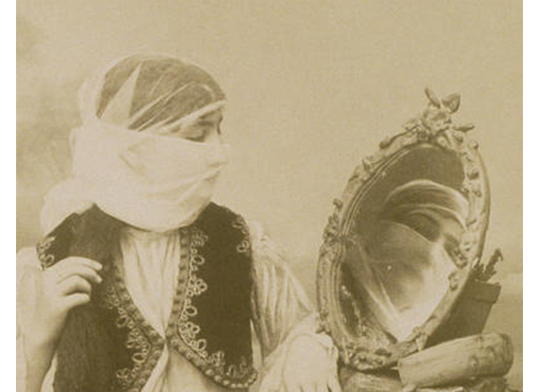 close-up of woman with veil looking into a mirror