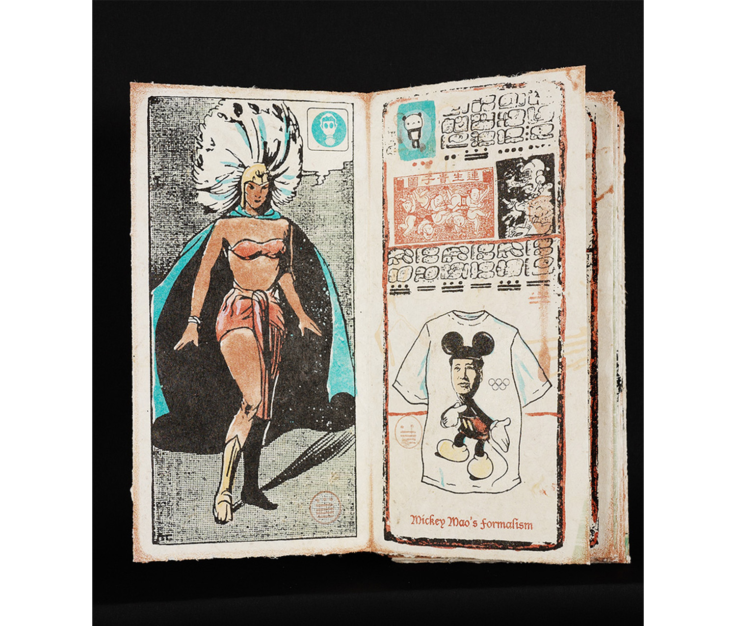 An open book. Left page: woman with blonde hair wearing red bikini, yellow boots, blue cape, and a white feathered headpiece. Right page: various drawings and symbols along the top; t-shirt of a man’s face on Mickey Mouse’s body on the bottom; red text at the bottom of the image reads, “Mickey Mao’s Formalism.”