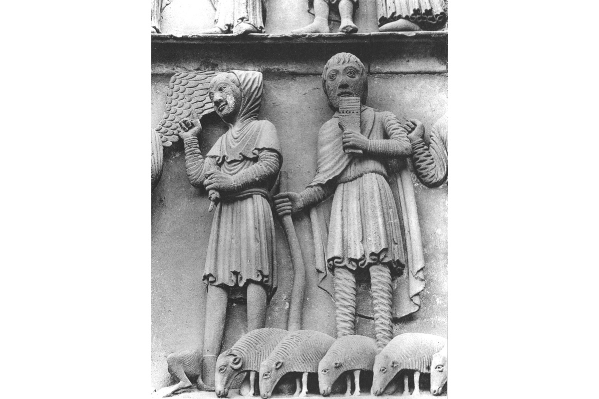 "shepherds carvings on the side of the Notre Dame cathedral"