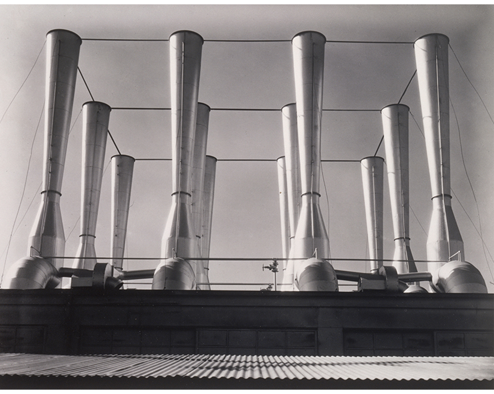 black and white image of factory smoke stacks