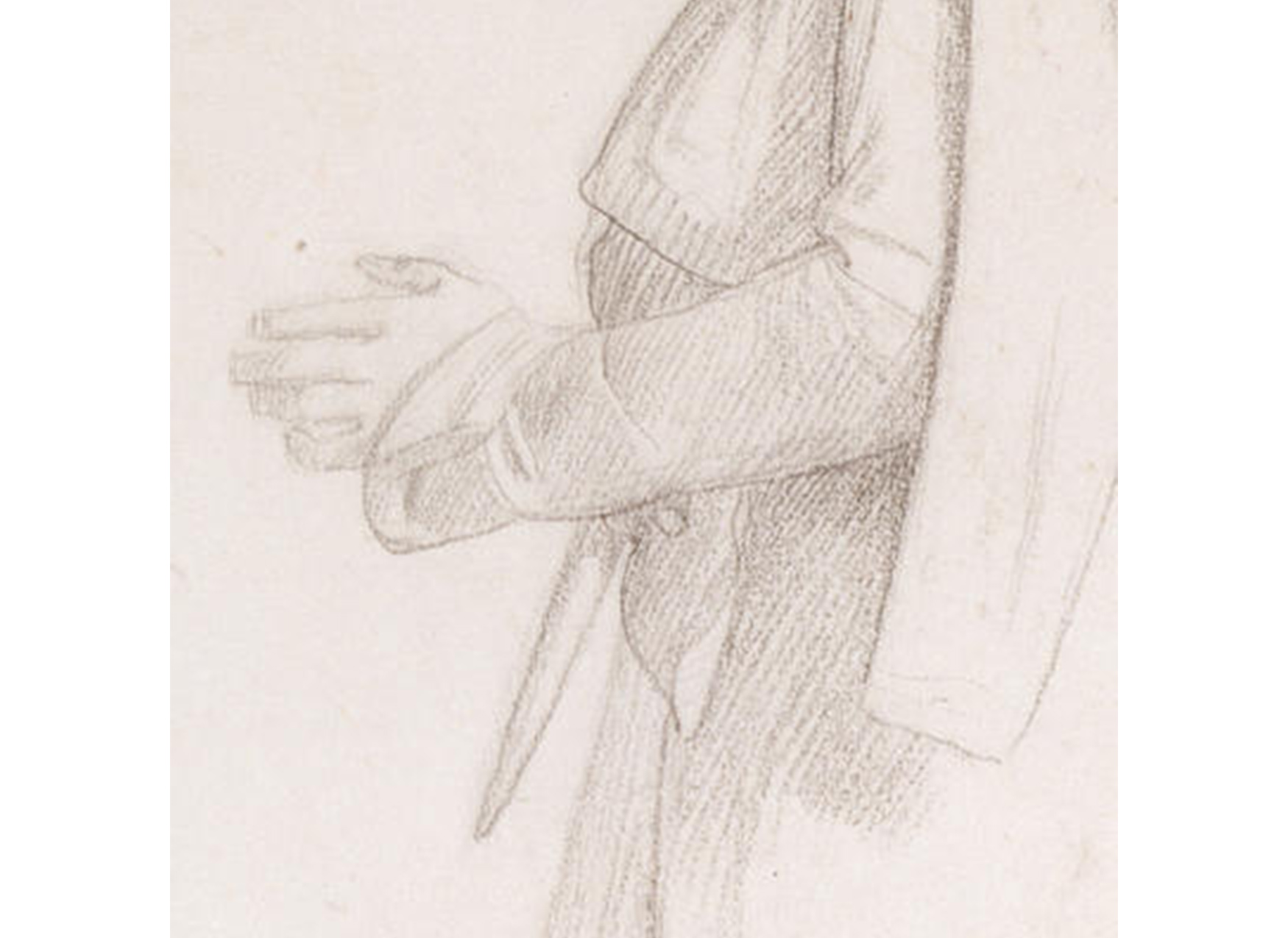 close-up of a man's hands clasped at his waist
