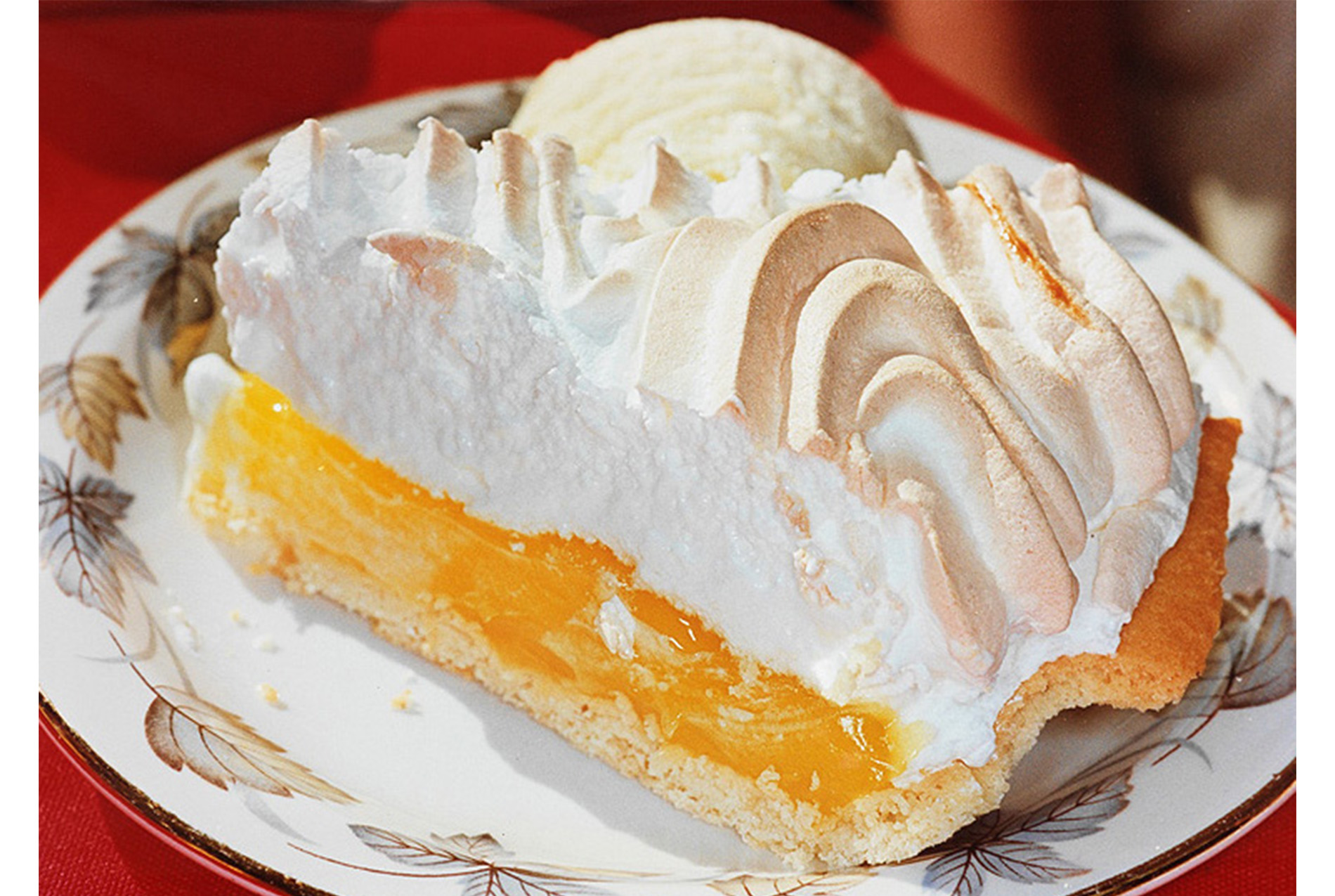 close-up of a slice of lemon meringue pie