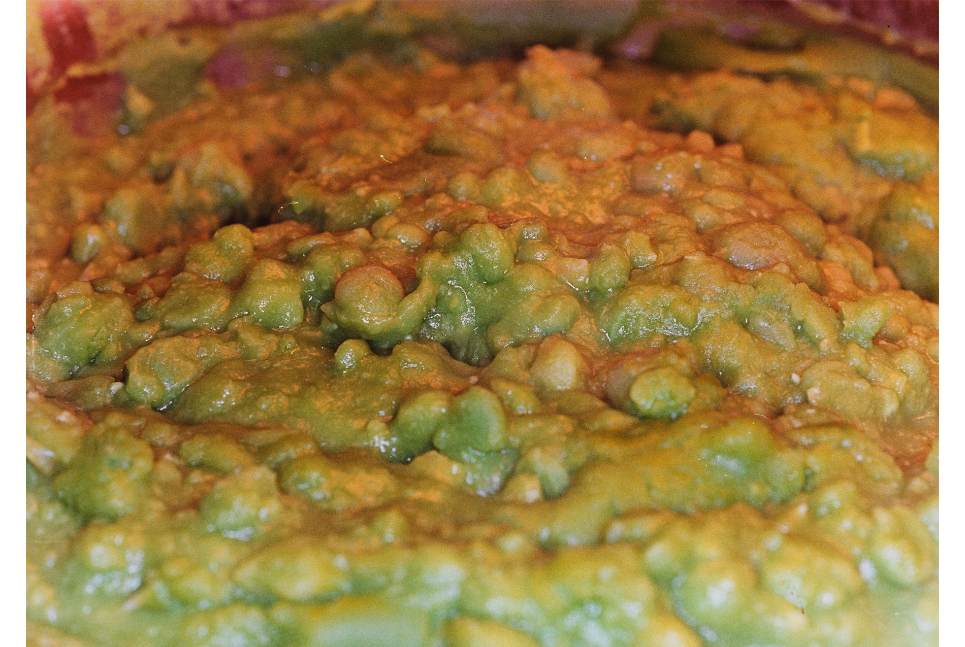 close-up of a mound of smashed green peas