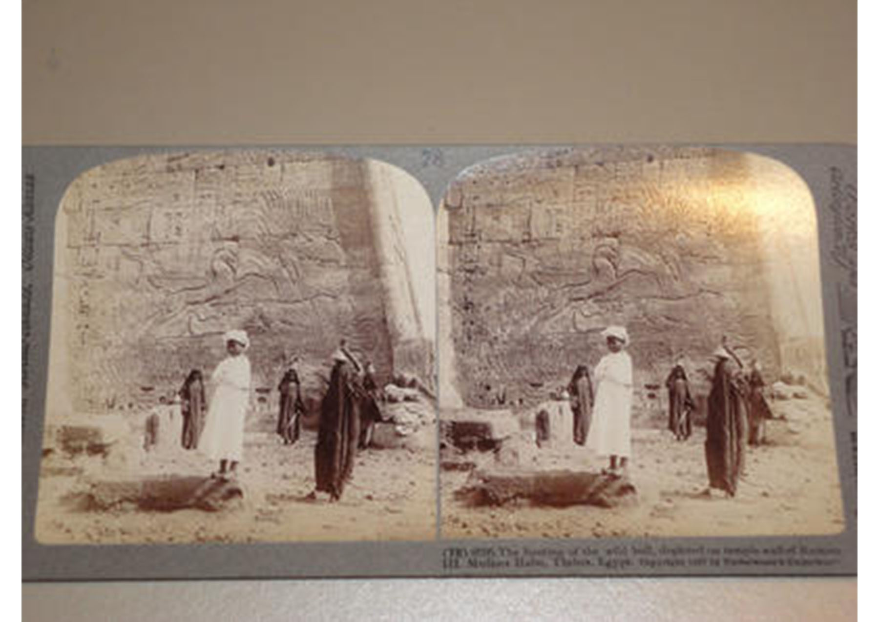 two identical images side by side of people standing in front of an Egyptian tomb