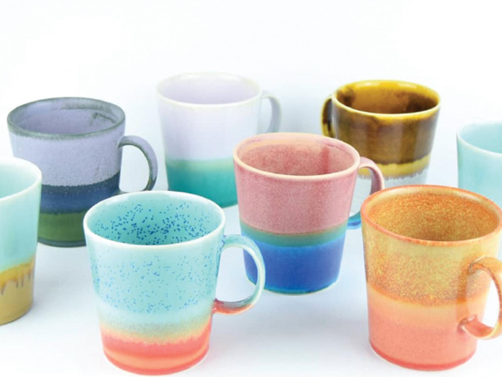 8 ceramics cups with stripes of many different colors