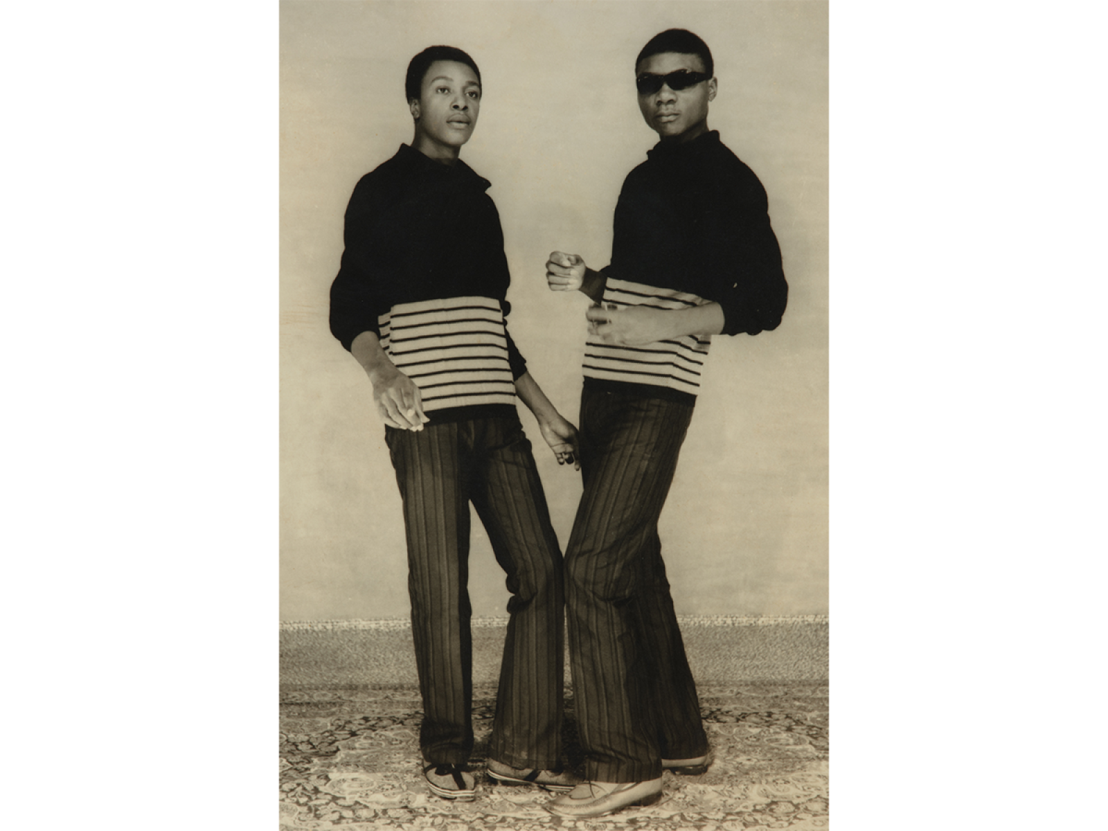 Two men dancing in matching outfits