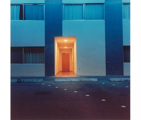 blue building with a glowing gold doorway