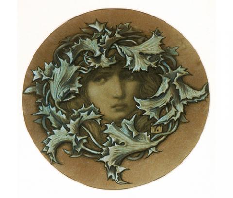 circular image of woman's face framed by leaves