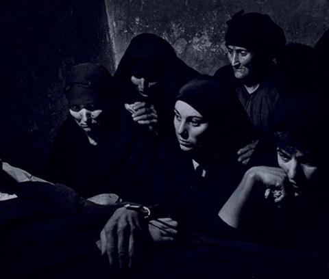 group of women wearing black clothing and veils 