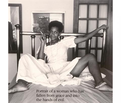 black woman seated on bed wearing white dress and holding a cigarette, legs spread open, text between her legs: "Portrait of a woman who has / fallen from grace and into / the hands of evil."