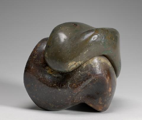 sculpture in two undulating parts that fit together in a cube-like shape; smooth yet textured surface; one half is more green in tone, other half is a richer brown