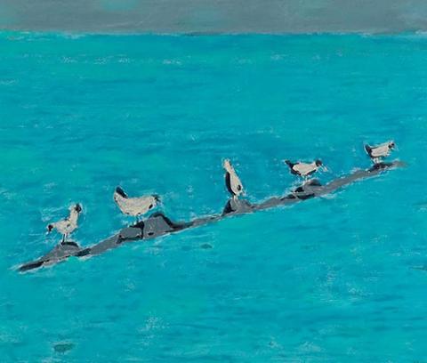 blue sea and sky with gulls on grey rocks set diagonally in center