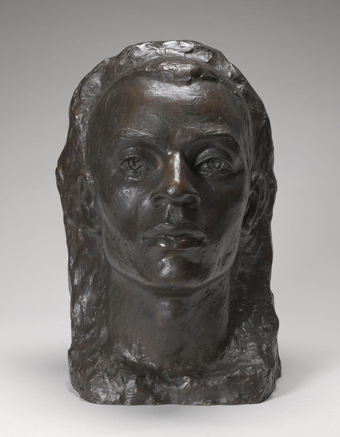 A bronze cast of the head of a man