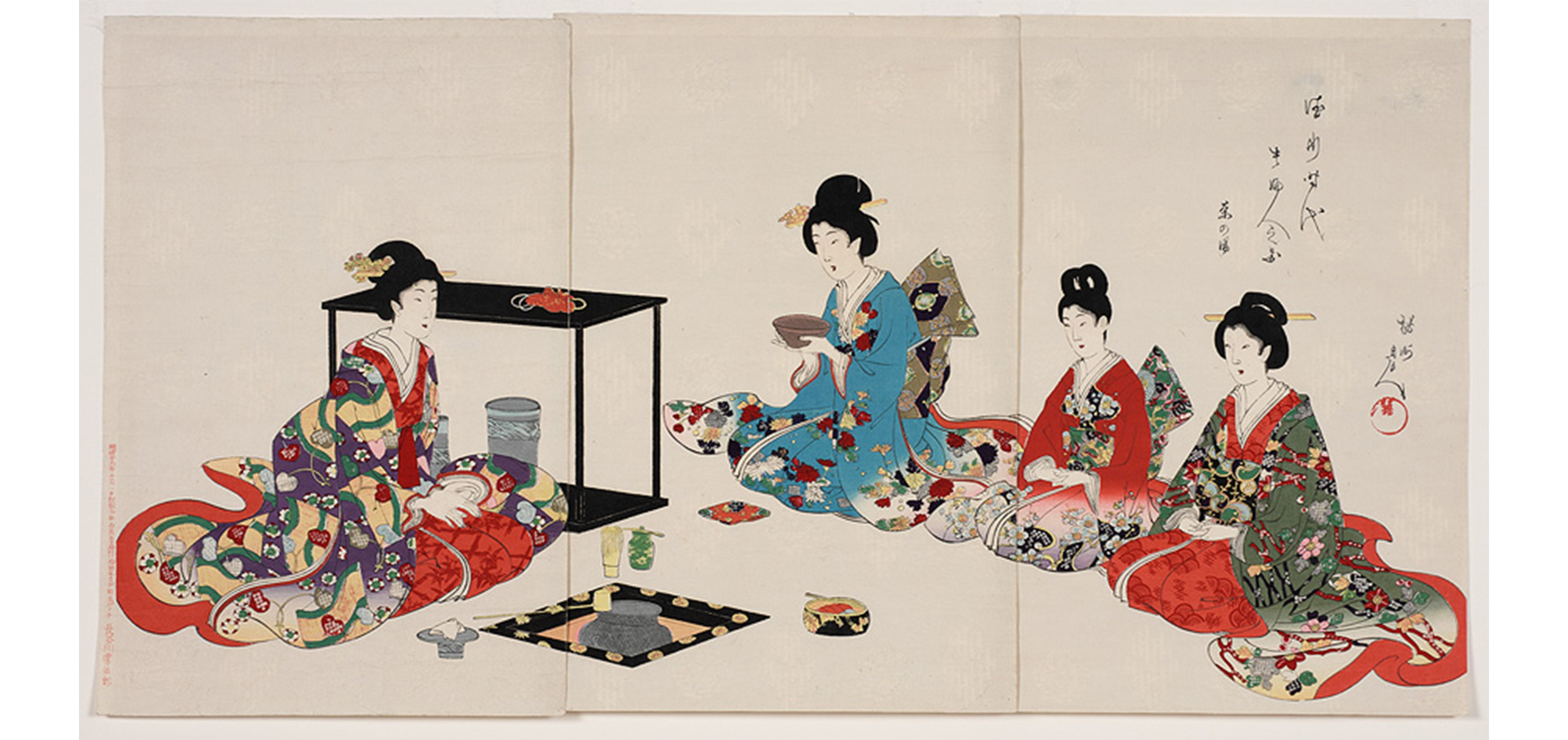 traditional Japanese tea ceremony with four women seated before a sunken hearth and tea ceremony objects, one woman is holding a tea bowl