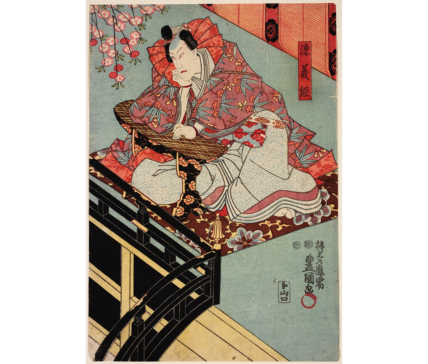 Man seated on a brown cushion wearing an elaborate robe, leaning on a lacquered table; branches of a blooming cherry tree upper left corner